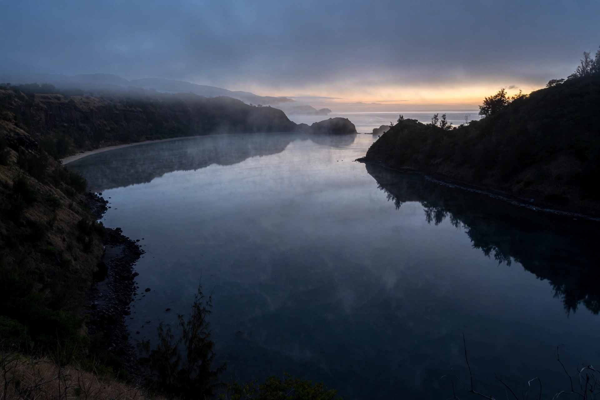 Honolua Bay glassy and still under dawn mist